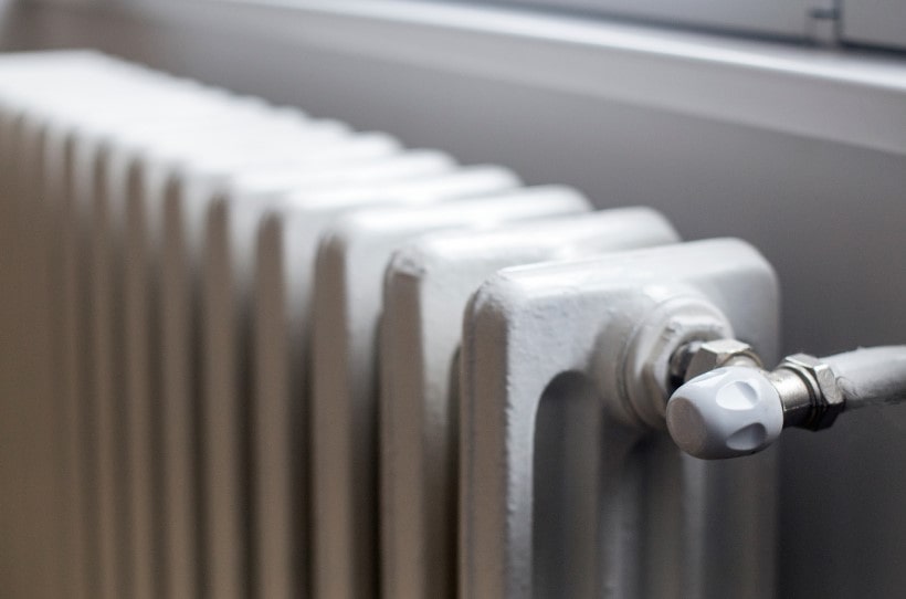 School radiator after just being cleaned of dust using special tool brush