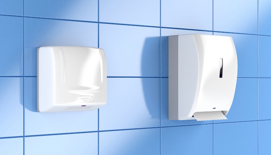 Hand dryer and paper towel dispenser in school toilets.