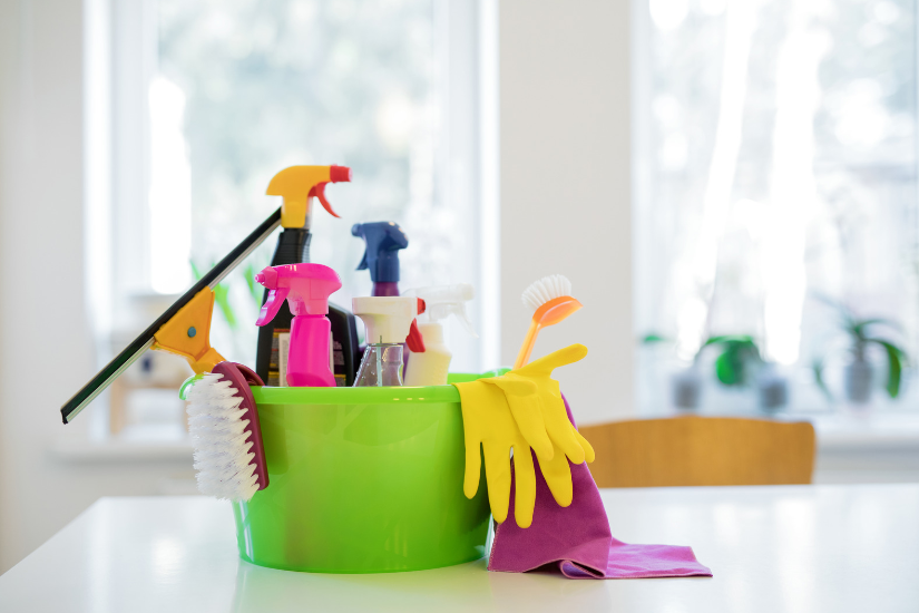 An image of fragranced cleaning supplies in a green bucket